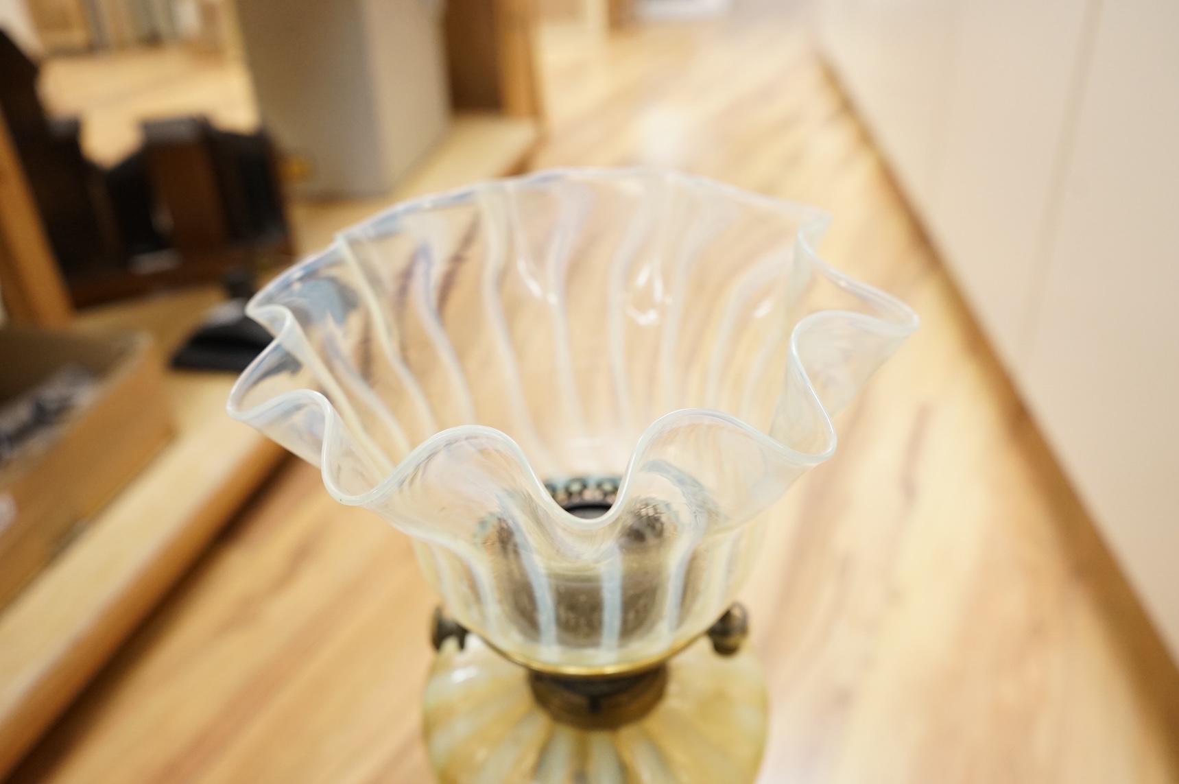 An Edwardian vaseline glass and brass oil lamp and shade, 56cm high